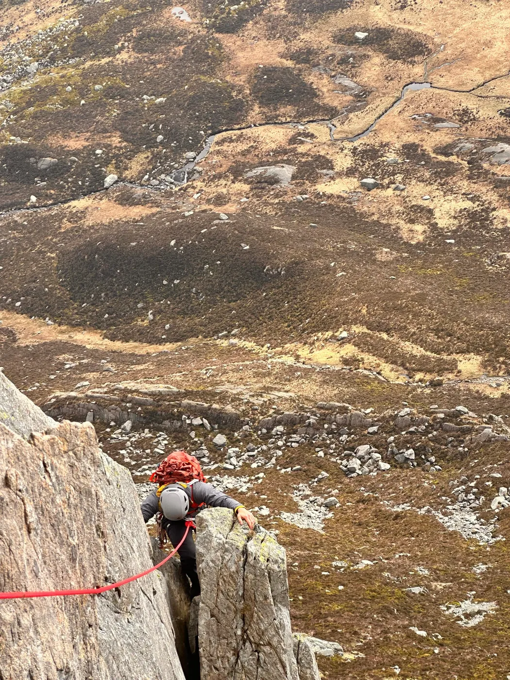Instructor on exposed climbing terrain